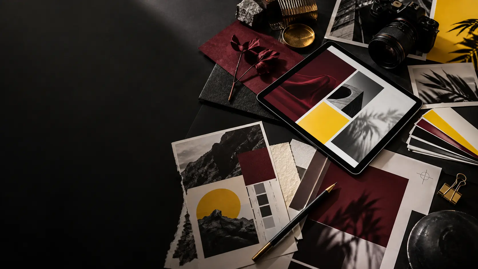 Creative studio desk with brand and digital design materials